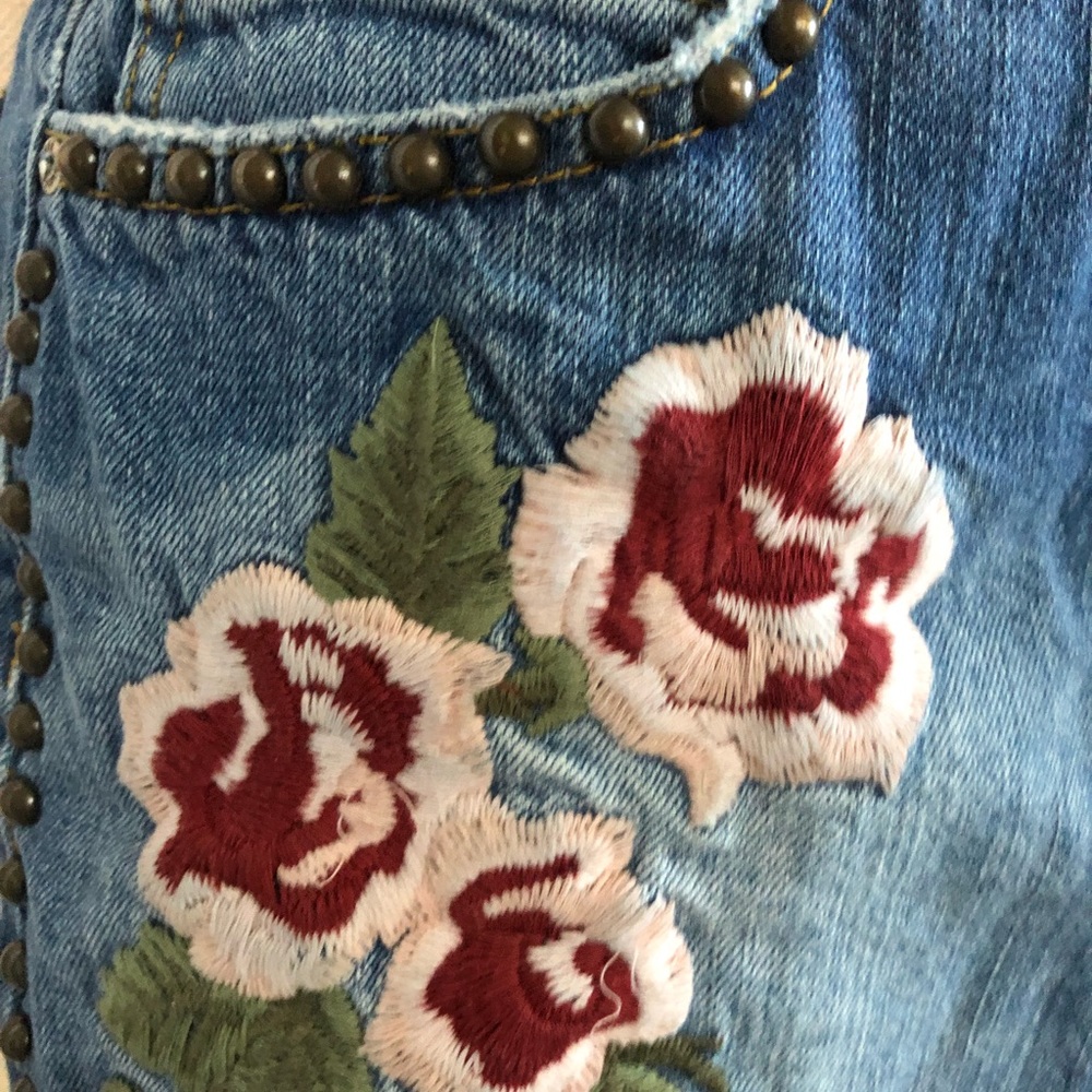 Free people denim skirt. Floral embroidery studs.